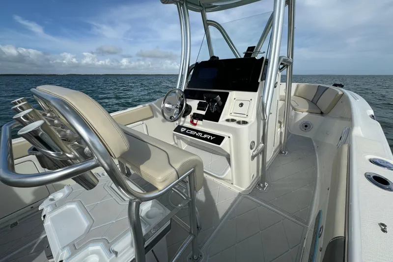 Slide: The Image of 2015 Century 2600 CC boat interior with helm, seating, and ocean view. - 47