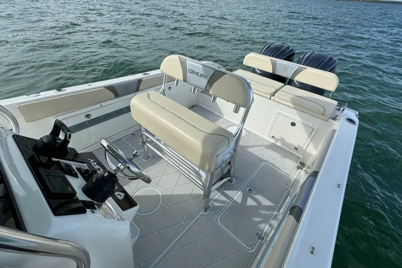Slide: The Image of 2015 Century 2600 CC boat interior with seating and controls on open water. - 53