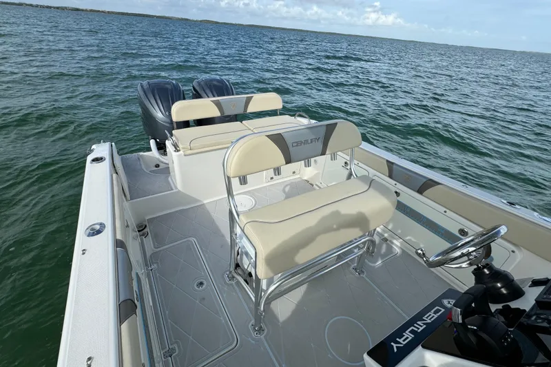 Slide: The Image of 2015 Century 2600 CC boat interior with dual engines on open water. - 55