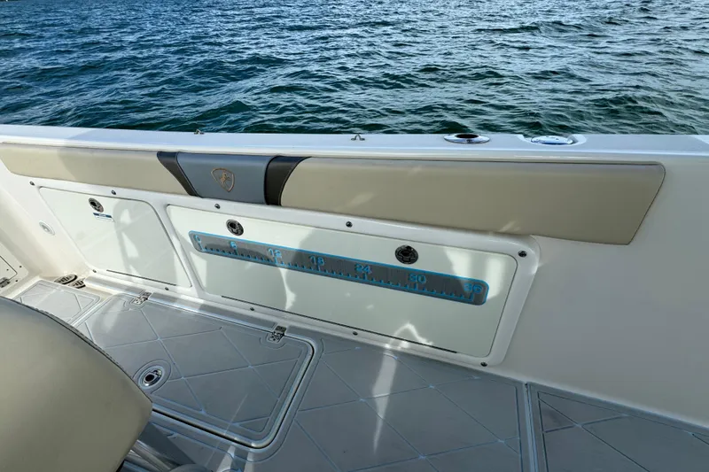 Slide: The Image of 2015 Century 2600 CC boat interior with measuring scale, on calm water. - 57
