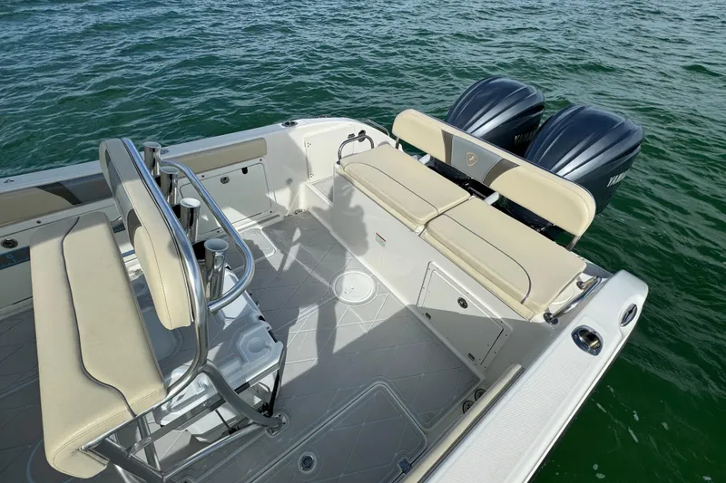 Slide: The Image of 2015 Century 2600 CC boat interior with dual Yamaha engines on the water. - 63