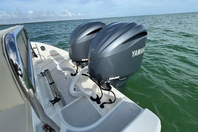 Slide: The Image of 2015 Century 2600 CC boat with dual Yamaha outboard engines on the water. - 67