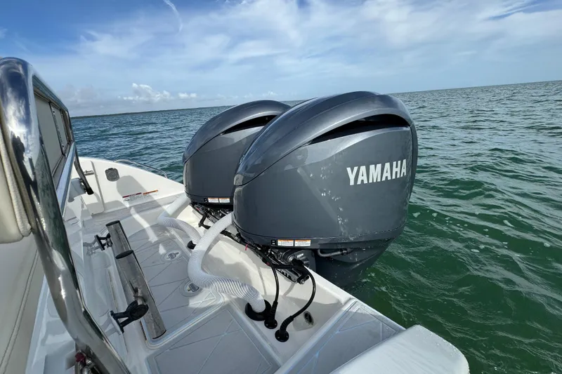Slide: The Image of 2015 Century 2600 CC boat with dual Yamaha outboard motors on open water. - 69