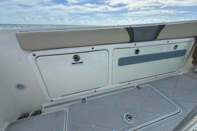 Slide: The Image of 2015 Century 2600 CC boat interior with storage compartments and ruler, ocean view. - 73