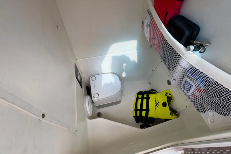 Slide: The Image of Interior of 2015 Century 2600 CC boat with toilet and storage area. - 85