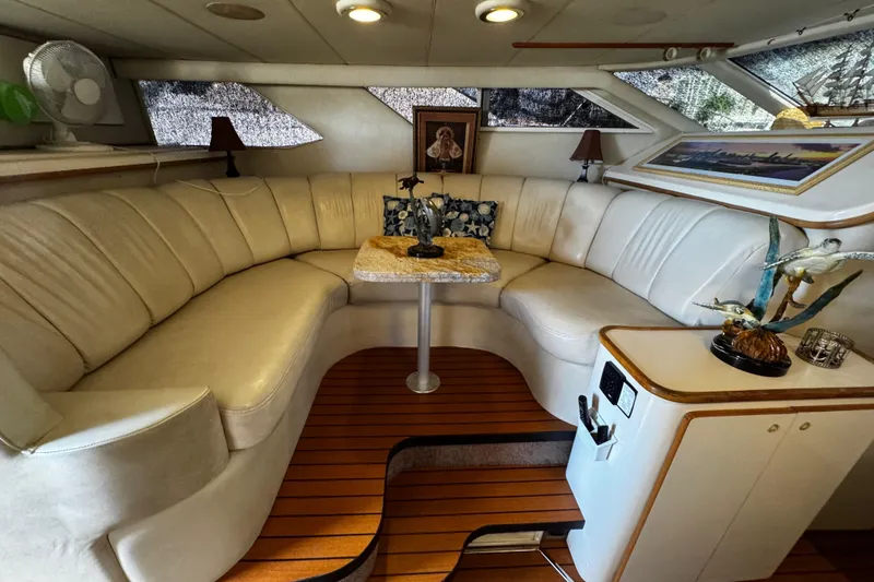 Slide: The Image of Luxurious 1999 Sea Ray 440 Express Bridge interior with plush seating and elegant decor. - 27