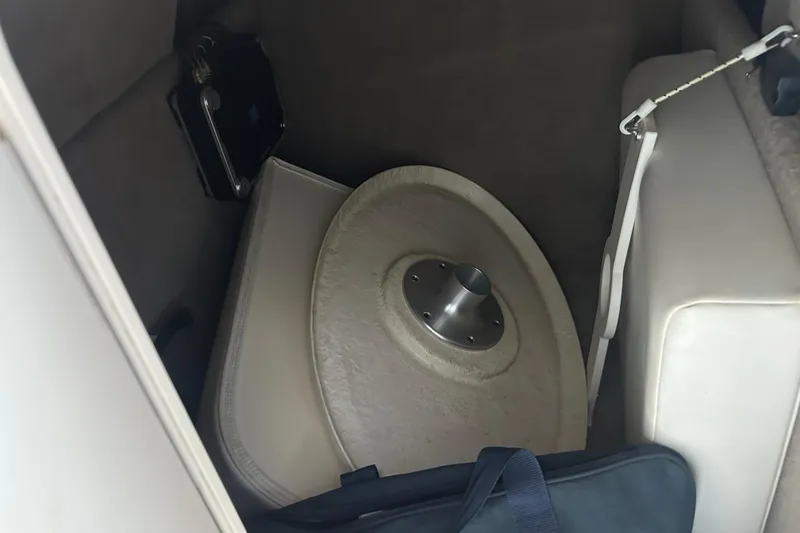 Slide: The Image of Storage compartment in a 2008 Chaparral 276 SSX boat with table and cushion. - 14