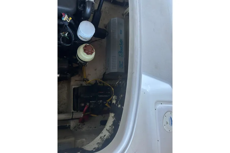 Slide: The Image of Engine compartment of 2008 Chaparral 276 SSX boat, showing battery and components. - 6