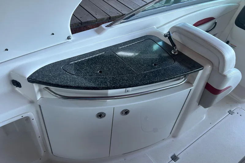 Slide: The Image of 2008 Chaparral 276 SSX boat interior with sleek countertop and built-in sink. - 8