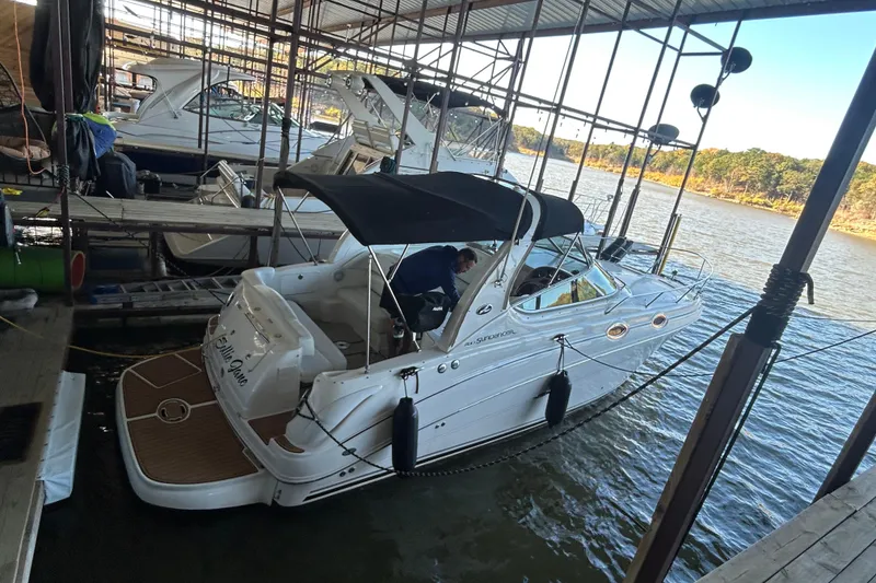 The Image of 2005 Sea Ray 280 Sundancer docked in a marina with scenic water view. - 0