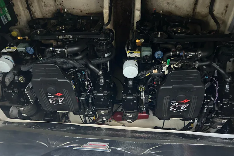 Slide: The Image of Engine compartment of a 2005 Sea Ray 280 Sundancer boat, featuring dual MerCruiser 4.3 MPI engines. - 21