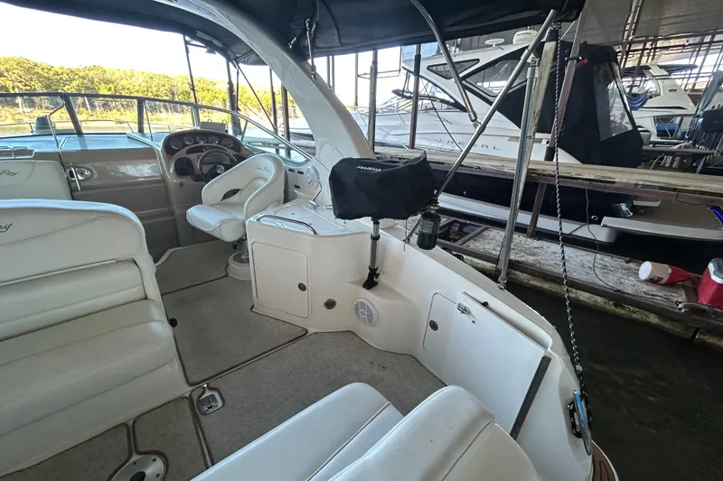 Slide: The Image of Interior of 2005 Sea Ray 280 Sundancer boat with seating and helm. - 7