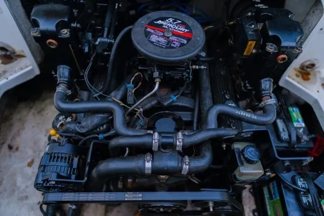 Slide: The Image of Engine of a 2007 Sea Ray 215 Weekender boat, featuring a 5.0L MerCruiser. - 11