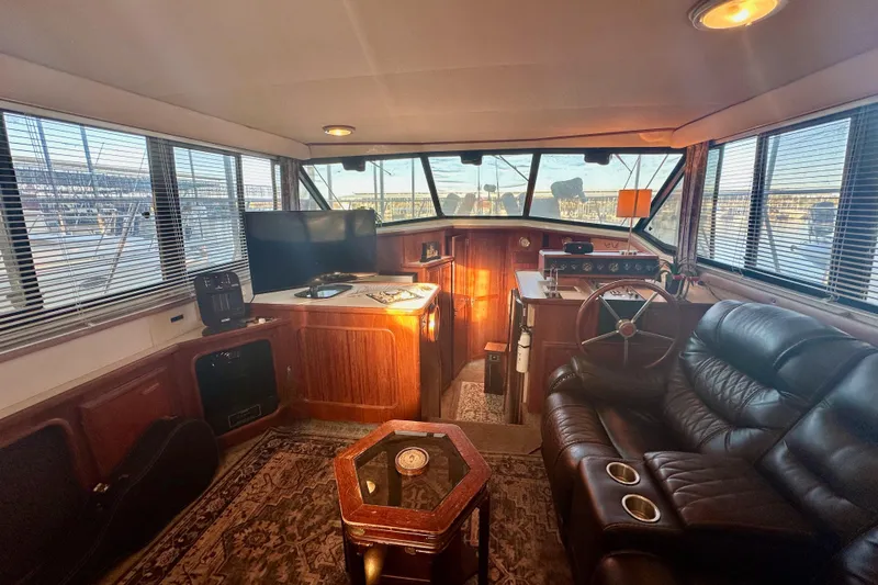 Slide: The Image of Interior of 1989 Carver 38 Aft Cabin Motor Yacht with leather seating and helm. - 14