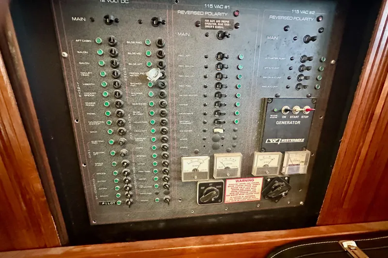 Slide: The Image of Electrical control panel of 1989 Carver 38 Aft Cabin Motor Yacht with generator controls. - 25