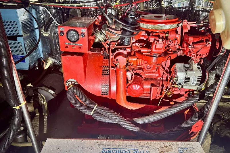 Slide: The Image of Engine room of 1989 Carver 38 Aft Cabin Motor Yacht with red machinery. - 26