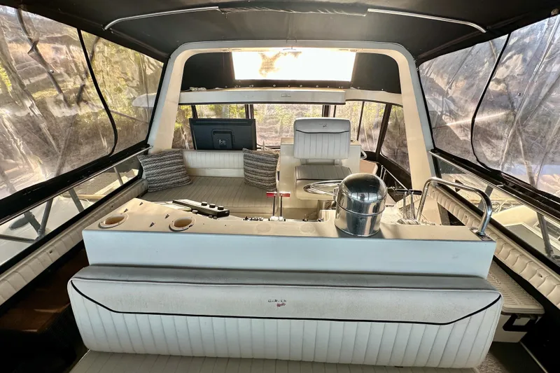 Slide: The Image of Interior of 1989 Carver 38 Aft Cabin Motor Yacht with helm and seating area. - 8