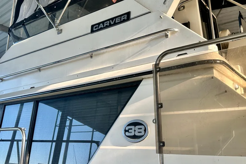 Slide: The Image of 1989 Carver 38 Aft Cabin Motor Yacht, side view with railing and windows. - 10