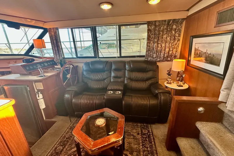 Slide: The Image of Interior of 1989 Carver 38 Aft Cabin Motor Yacht with leather seating and nautical decor. - 15