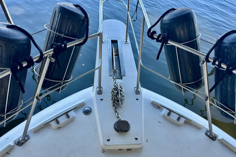 Slide: The Image of Bow of 1989 Carver 38 Aft Cabin Motor Yacht with fenders and anchor chain. - 3