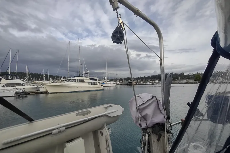 Slide: The Image of 1993 Beneteau Moorings 445 sailboat docked in a marina under cloudy skies. - 11