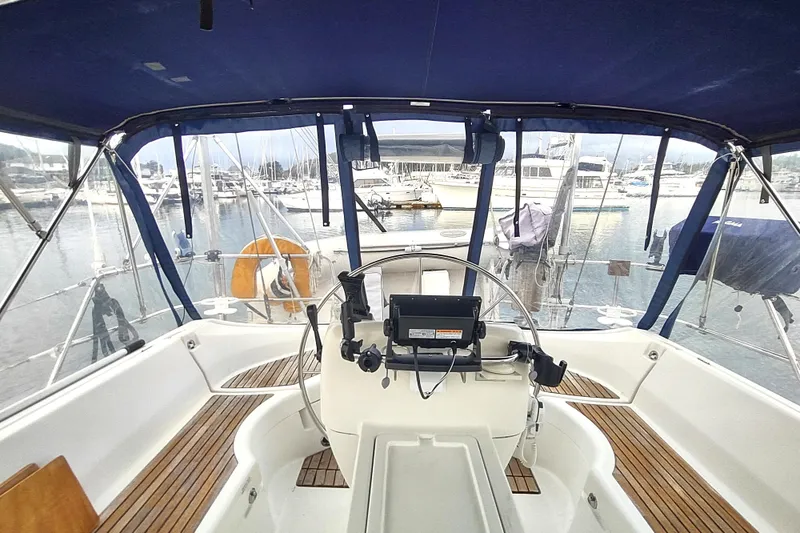 Slide: The Image of Cockpit view of 1993 Beneteau Moorings 445 sailboat in marina setting. - 14