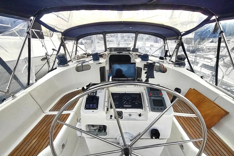 Slide: The Image of Cockpit of 1993 Beneteau Moorings 445 sailboat with steering wheel and navigation instruments. - 15