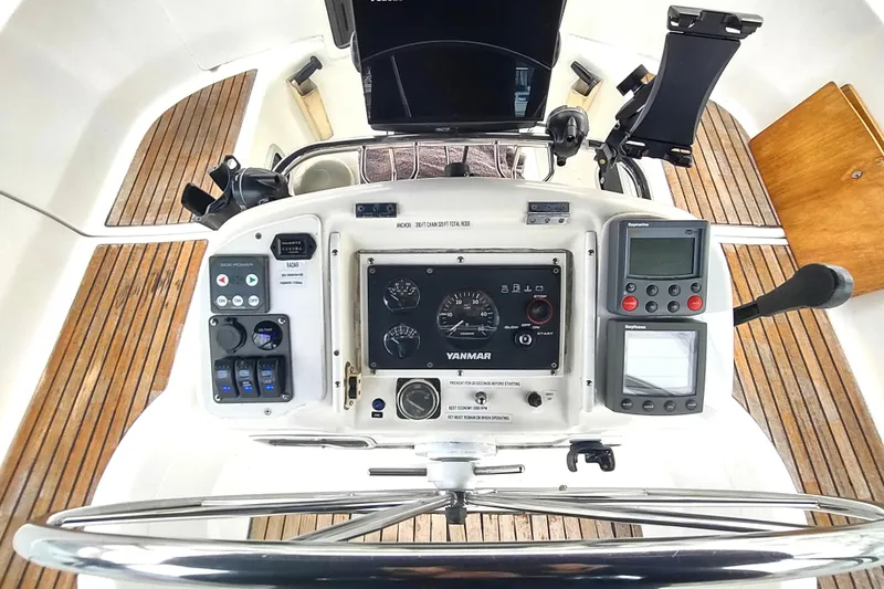 Slide: The Image of Cockpit of 1993 Beneteau Moorings 445 sailboat with Yanmar controls and navigation instruments. - 16