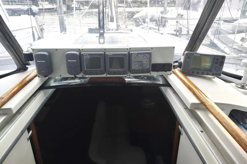 Slide: The Image of Navigation display on a 1993 Beneteau Moorings 445 sailboat, showing coordinates and map. - 18