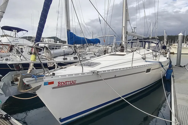 Slide: The Image of 1993 Beneteau Moorings 445 sailboat docked, featuring anchor and mooring equipment. - 2