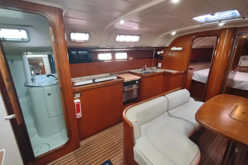 Slide: The Image of Cockpit view of 1993 Beneteau Moorings 445 sailboat, featuring navigation equipment and seating. - 22