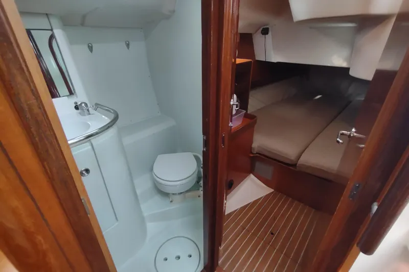 Slide: The Image of Interior of 1993 Beneteau Moorings 445 yacht showing cabin and bathroom. - 29