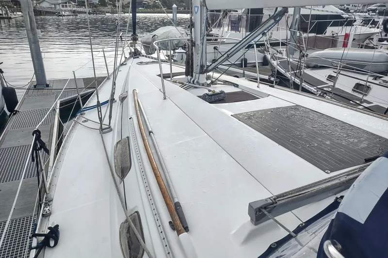 Slide: The Image of Sailboat Beneteau Moorings 445, 1993 model, docked at marina with wet deck. - 3
