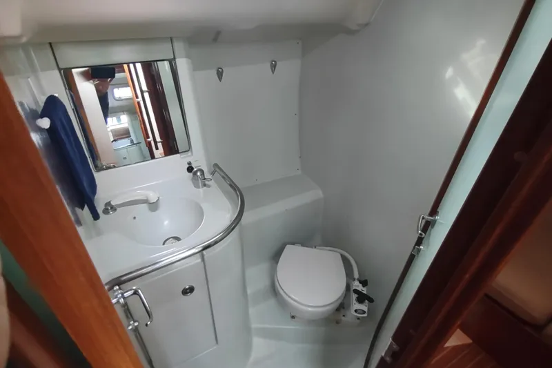 Slide: The Image of Bathroom interior of 1993 Beneteau Moorings 445 yacht, featuring sink and toilet. - 30