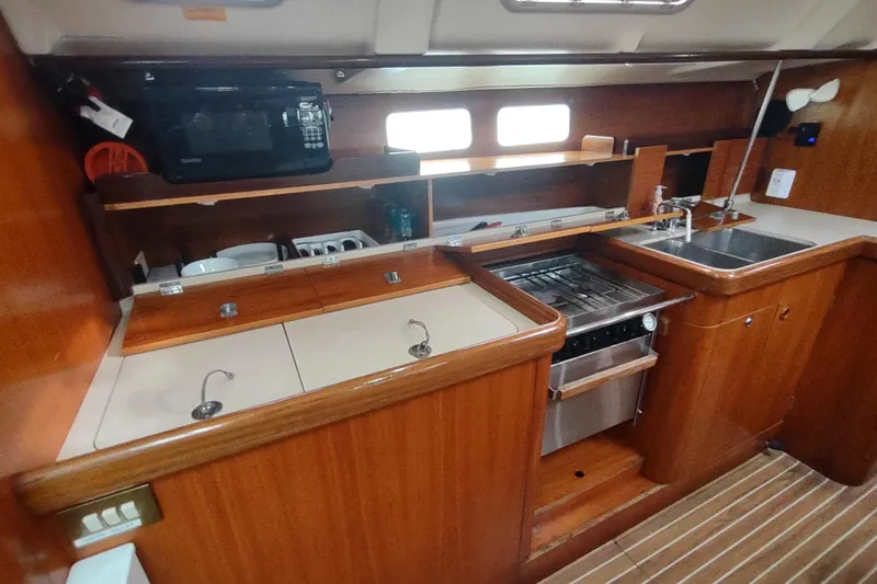 Slide: The Image of Interior cabin of 1993 Beneteau Moorings 445 sailboat with wooden finish and twin beds. - 35
