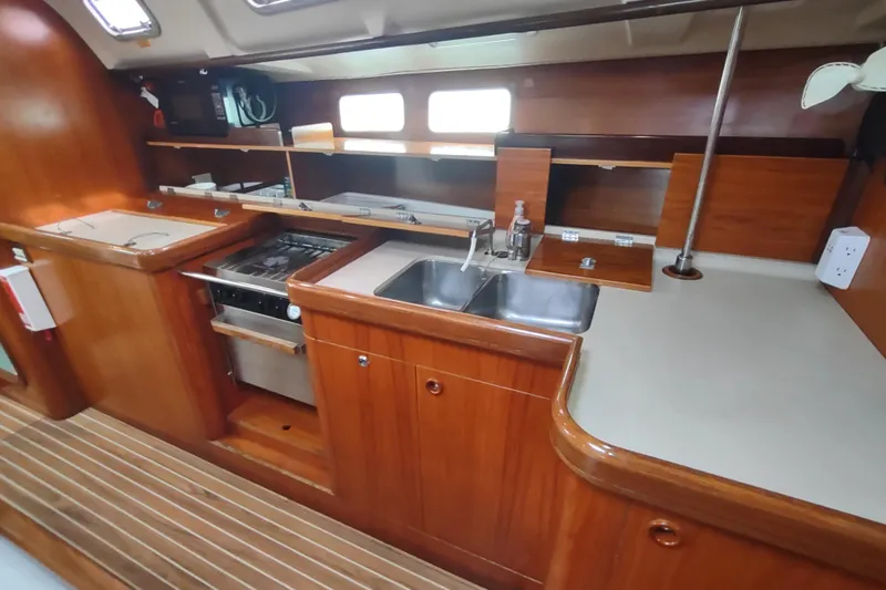 Slide: The Image of Open storage compartment in 1993 Beneteau Moorings 445 yacht, showing interior details. - 36
