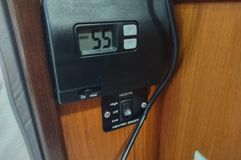 Slide: The Image of 1993 Beneteau Moorings 445 yacht kitchen with wood cabinetry, stove, and sink. - 38