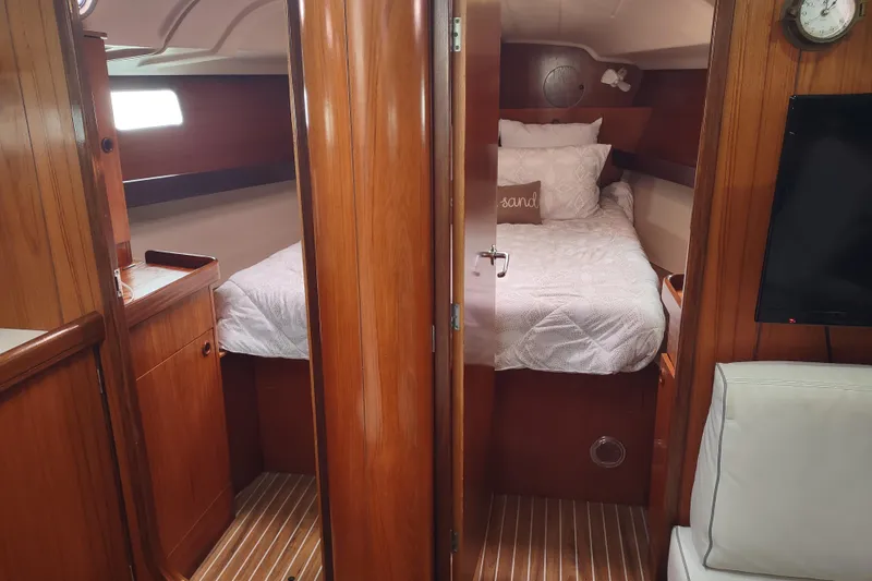 Slide: The Image of Interior of 1993 Beneteau Moorings 445 yacht kitchen with wooden cabinetry and appliances. - 39
