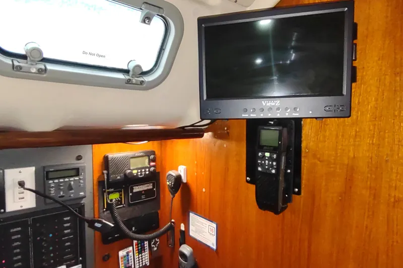 Slide: The Image of Interior of 1993 Beneteau Moorings 445 yacht with navigation equipment and monitor. - 45