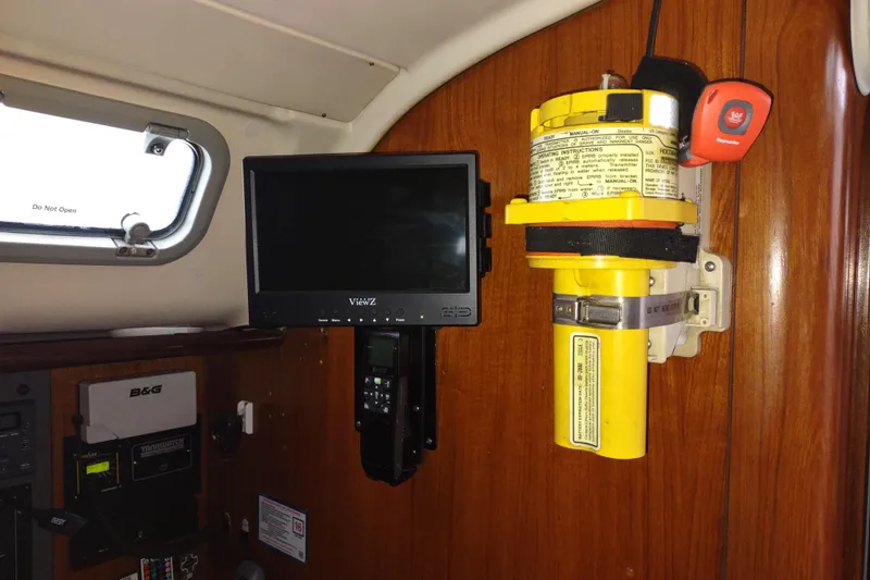 Slide: The Image of Interior of 1993 Beneteau Moorings 445 yacht with navigation equipment and emergency beacon. - 46