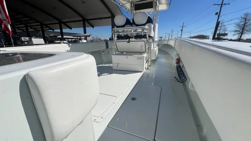 Slide: The Image of 2005 Contender 36 Open boat interior with seating and storage compartments. - 15