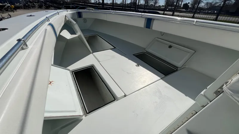 Slide: The Image of 2005 Contender 36 Open boat with open storage compartments. - 18