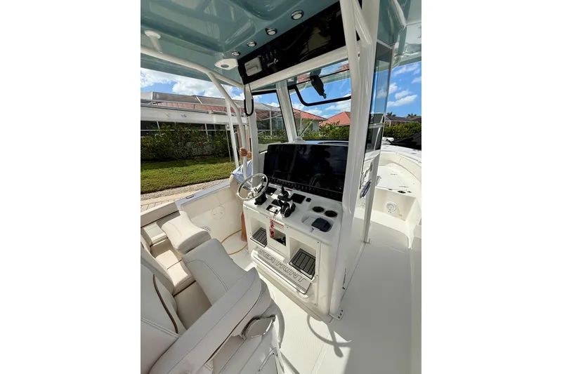 Slide: The Image of 2021 Sea Hunt Gamefish 30 boat with forward seating on a sunny day. - 10