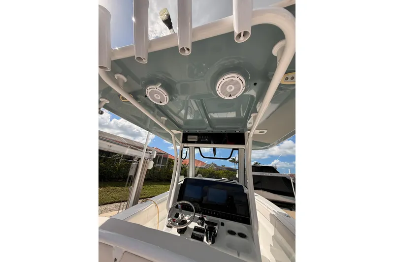 Slide: The Image of 2021 Sea Hunt Gamefish 30 boat with forward seating, on calm water. - 12