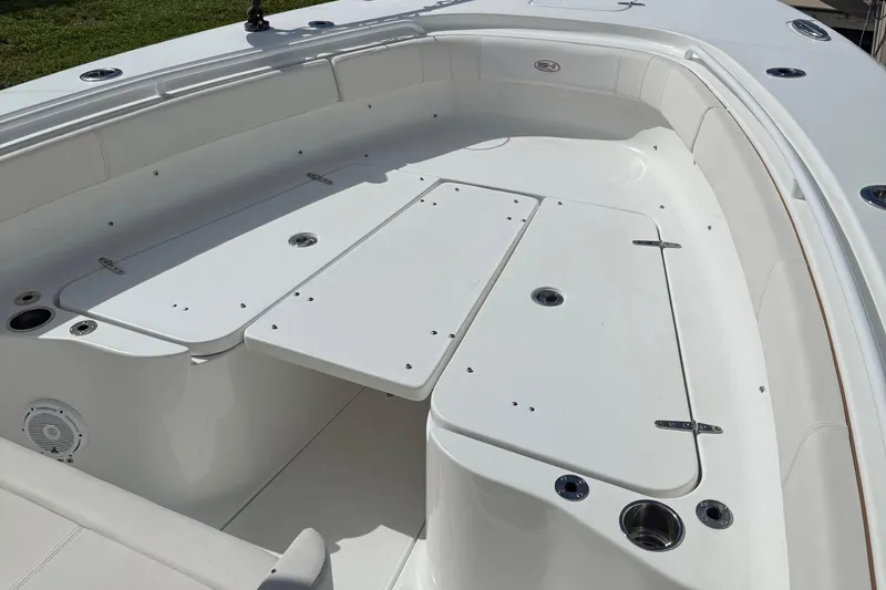 Slide: The Image of 2021 Sea Hunt Gamefish 30 boat with forward seating on a sunny day. - 13
