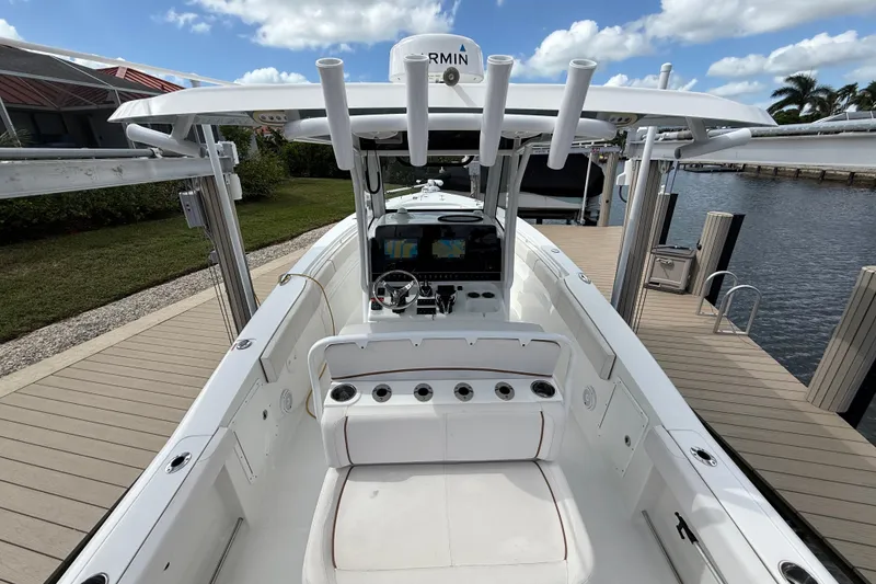 Slide: The Image of 2021 Sea Hunt Gamefish 30 boat with forward seating on calm water. - 17