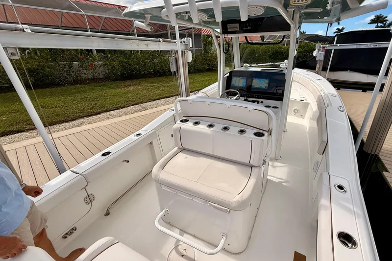 Slide: The Image of 2021 Sea Hunt Gamefish 30 boat on calm water with clear blue sky. - 19