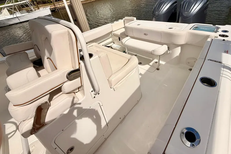 Slide: The Image of 2021 Sea Hunt Gamefish 30 boat with forward seating on calm water. - 20