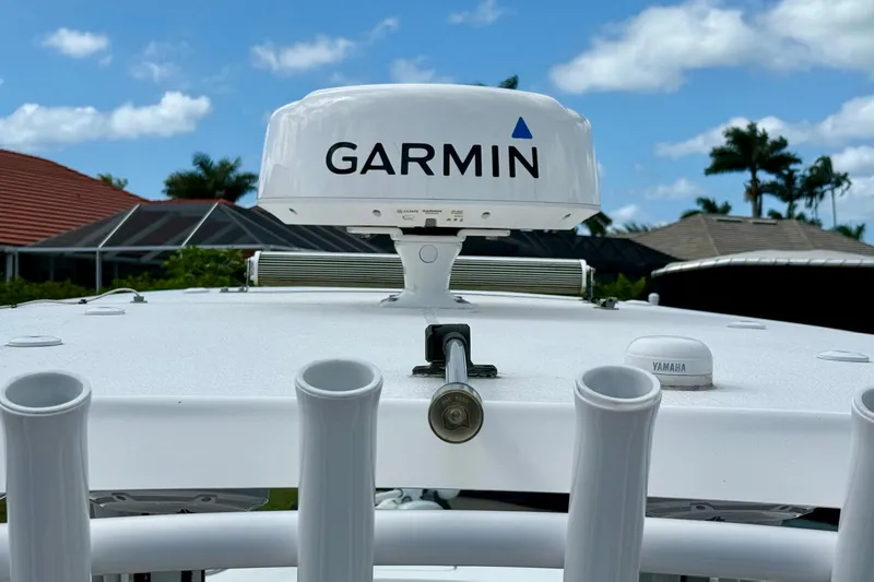 Slide: The Image of 2021 Sea Hunt Gamefish 30 boat with forward seating on calm water. - 22