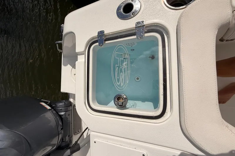 Slide: The Image of 2021 Sea Hunt Gamefish 30 boat with forward seating, docked near waterfront homes. - 25